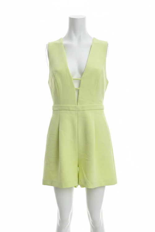 BCBGMAXAZRIA chartreuse romper, angled front view showing plunge neckline