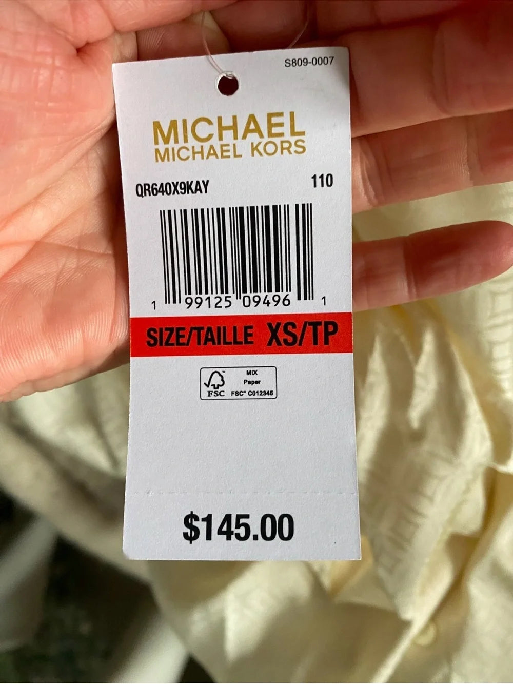 Michael Michael Kors blouse, care label showing 100% polyester, made in Cambodia