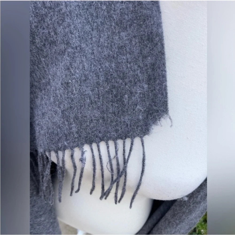 Acne Studios grey wool scarf draped on mannequin, front view